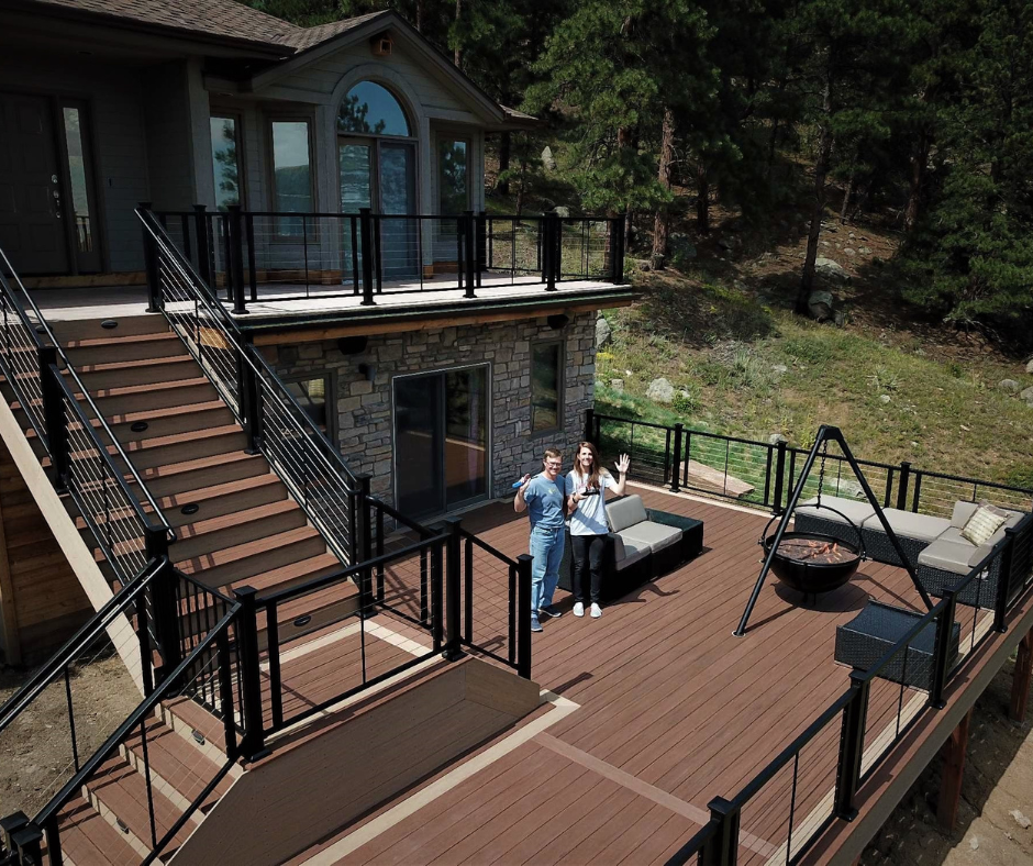 deck on the back of a house with black railings