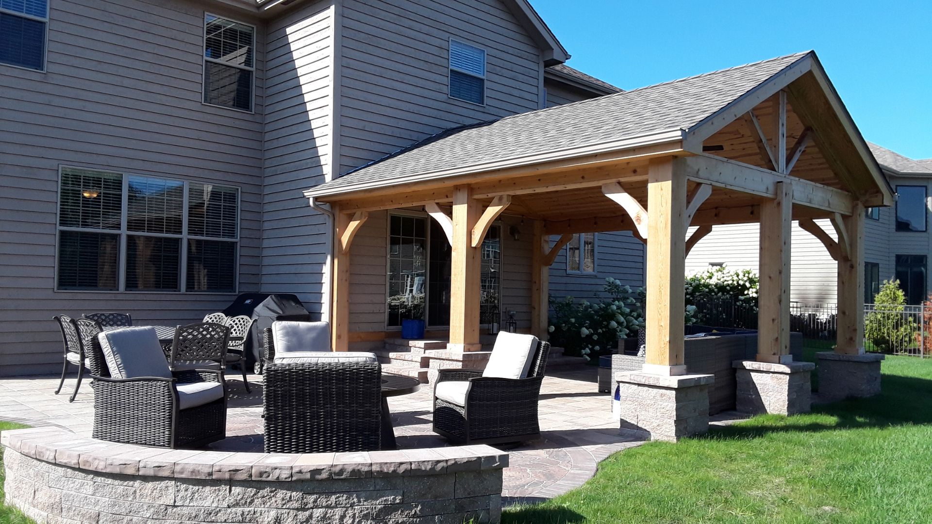 A patio with chairs and a covered patio