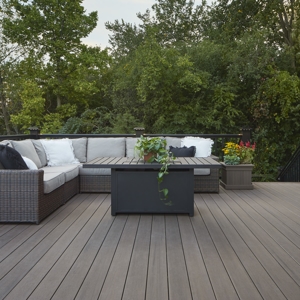 deck with couch and plants