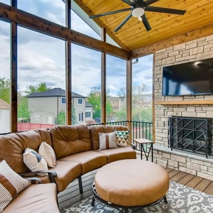 Screened porch with fireplace and composite deck flooring to enjoy the outdoors without the bugs!