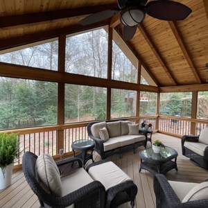 Large screened-in porch with exposed rafters