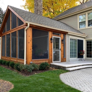 Gorgeous screened-in porch with adjacent patio