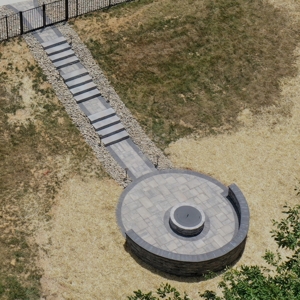 Expansive Built-in Fire Pit and Circular Patio