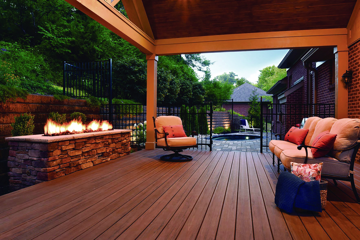 covered deck with outdoor fire place