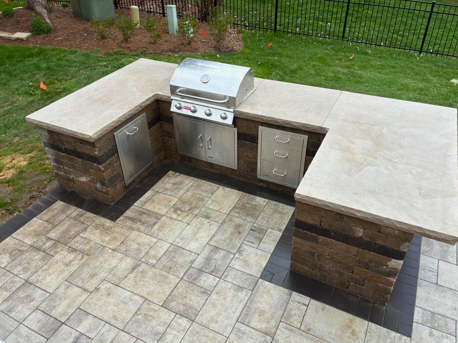 Gorgeous outdoor kitchen with limestone counters by kitchen contractor Archadeck of Chicagoland-Naperville..