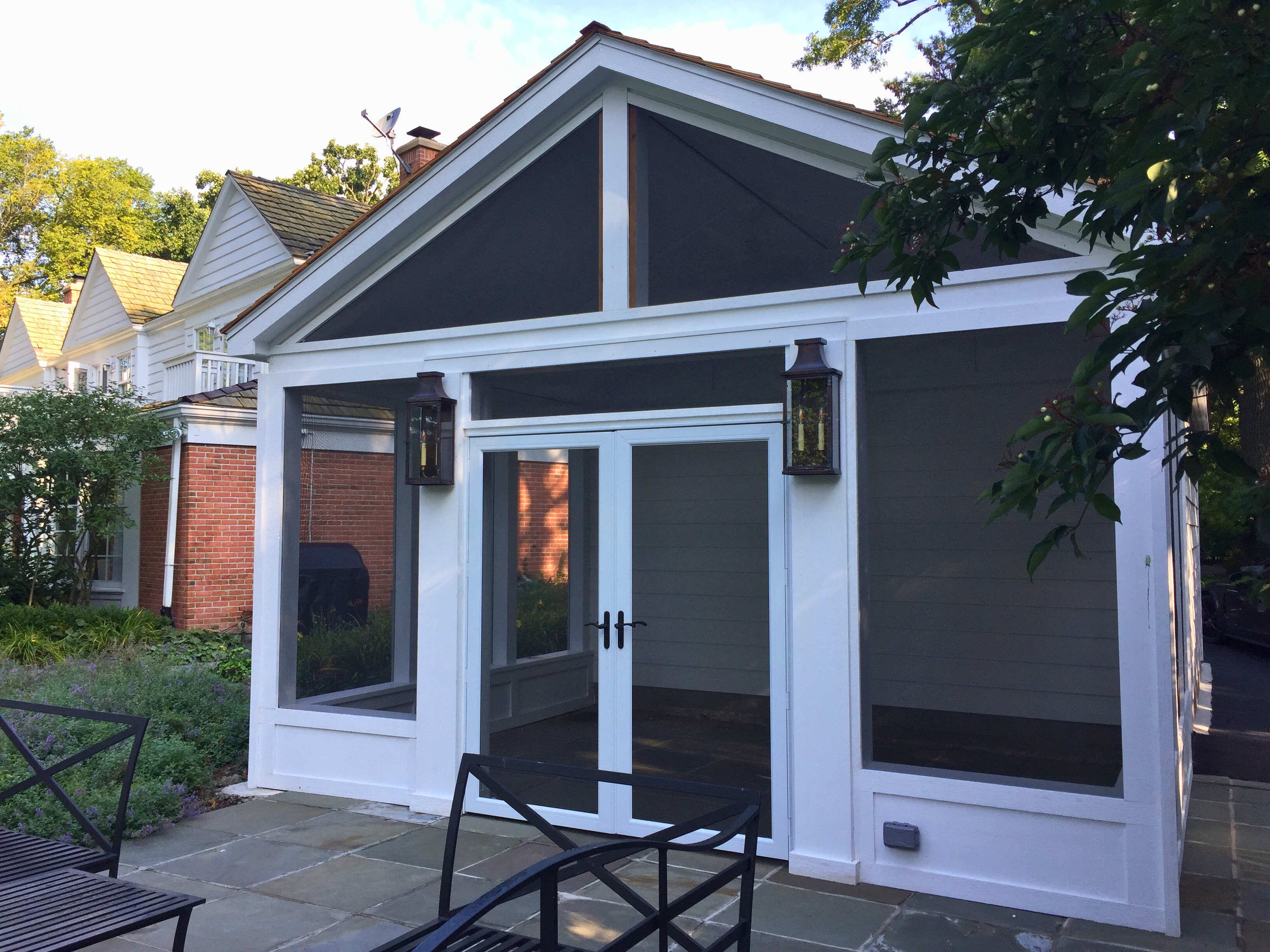 Enclosed patio in Naperville, IL with stunning screens and paver floor.