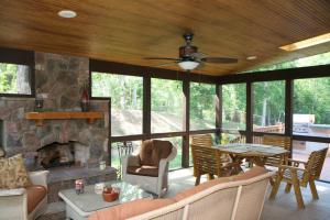 Outdoor fireplace and screened in deck 