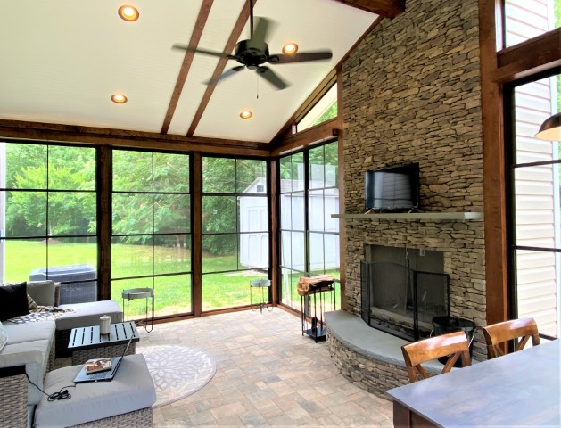 Enclosed porch with fireplace and fan