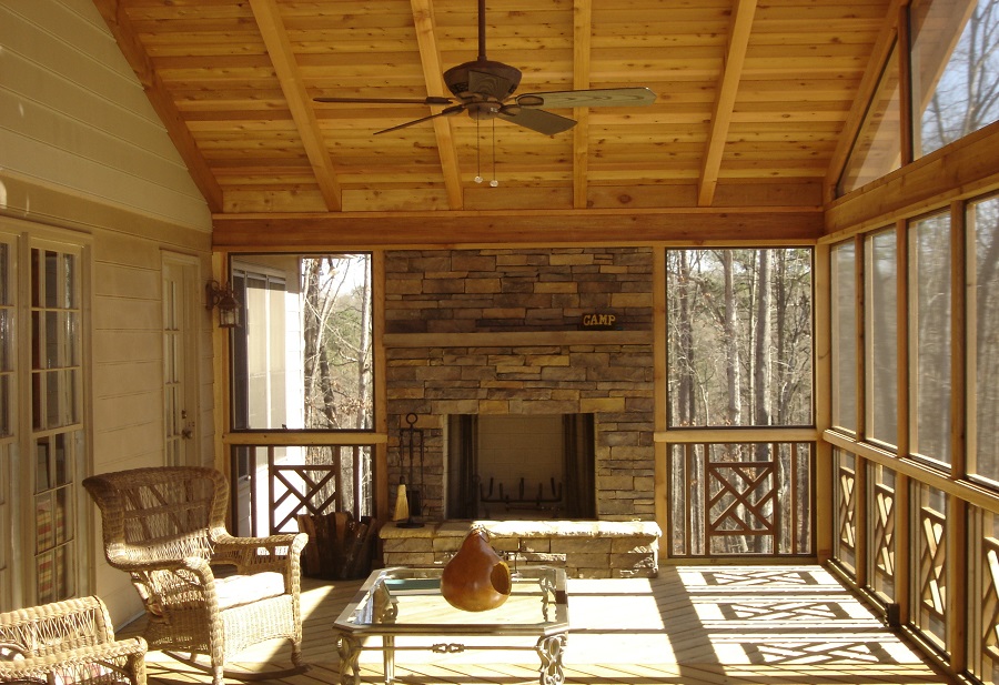 screened in porch with fireplace