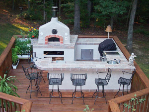 outdoor kitchen area with stone oven