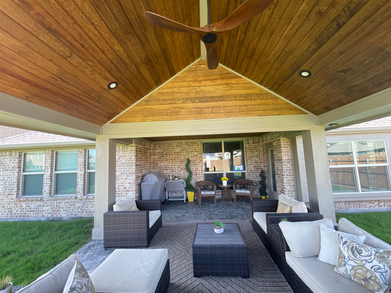 Mesquite, TX, gable roof covered patio open end with decorative truss details.