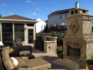 patio with outdoor furniture and fireplace