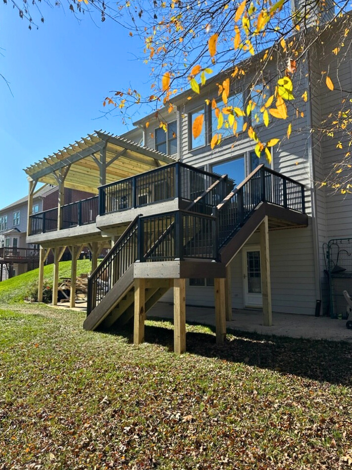 Two-level TimberTech deck with pergola and black railing in Huntersville NC.