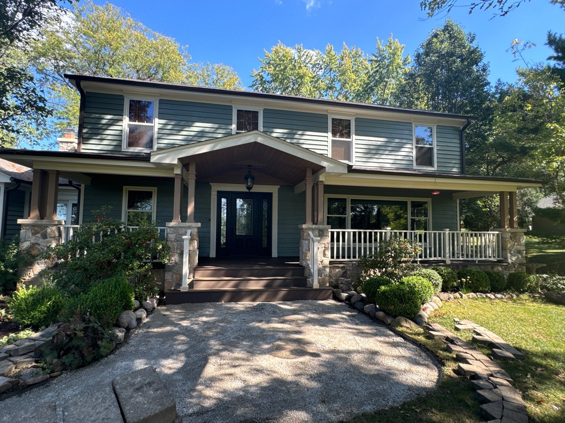 Front porch on a Deer park home with composite decking an stunning stone pillars..