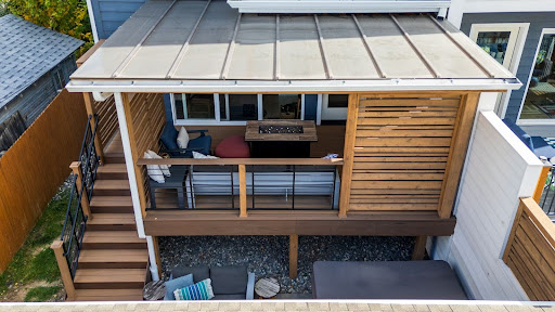 covered wood deck off the back of a home