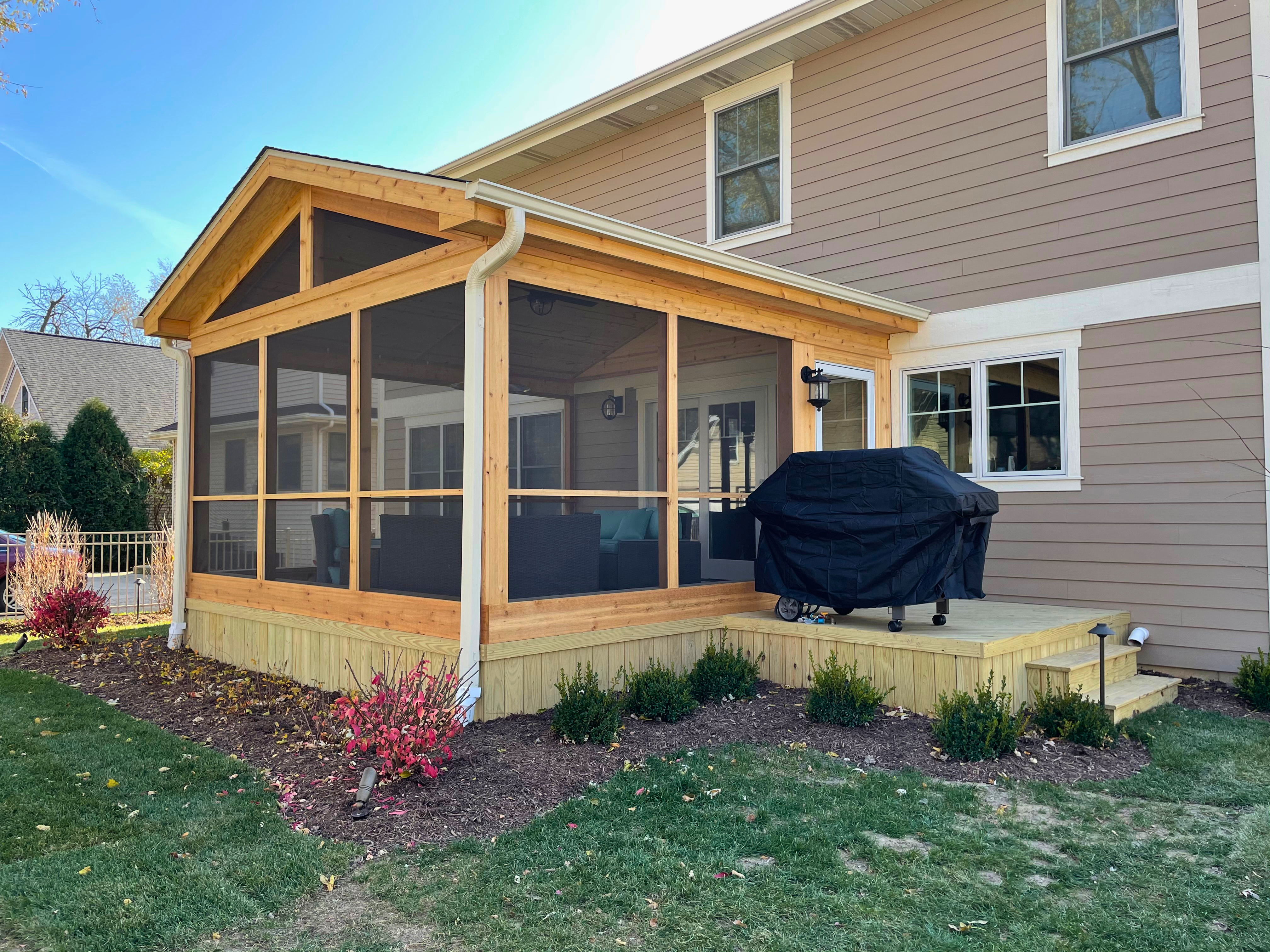 Custom screened porch with a small deck for a grill in Elmhurst, IL.