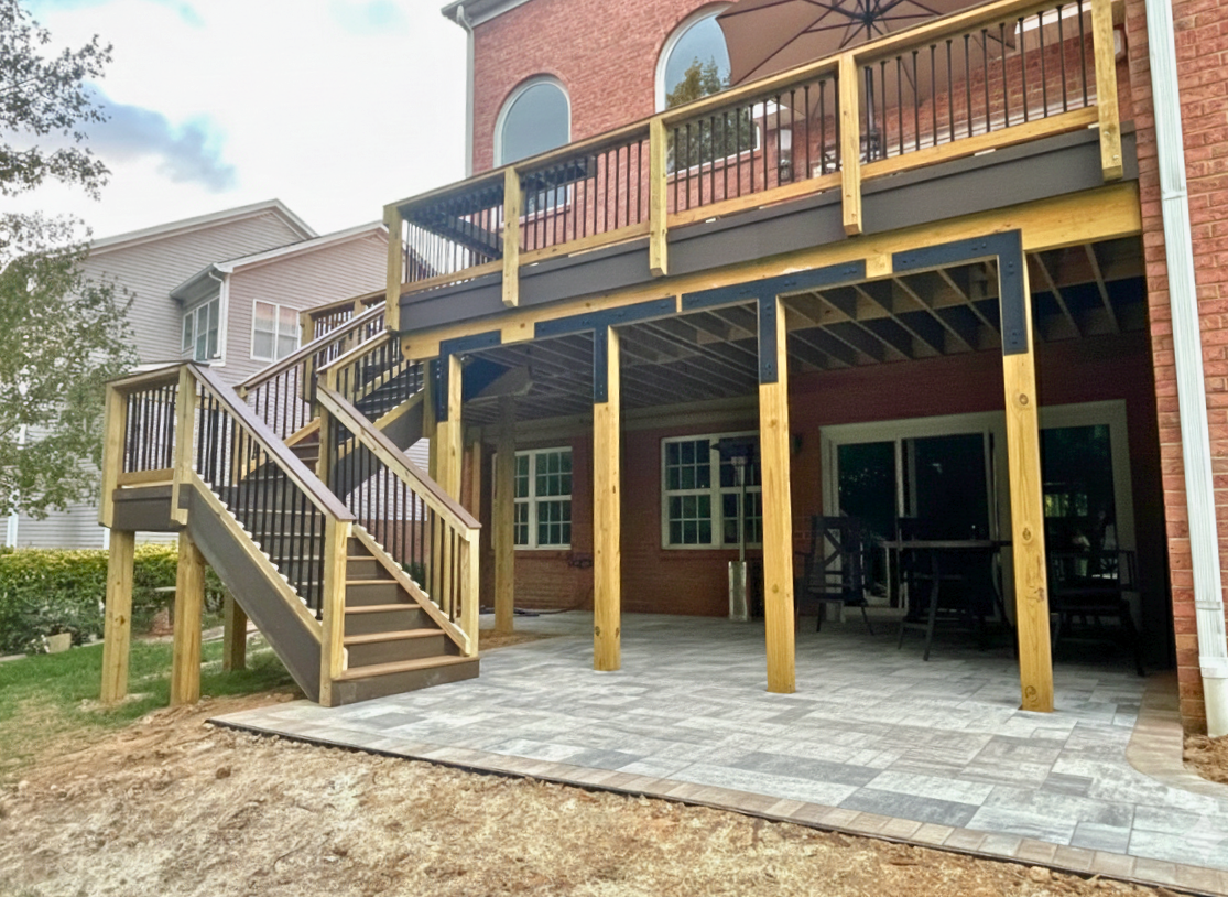 Custom elevated composite deck over a paver patio in Huntersville, NC.