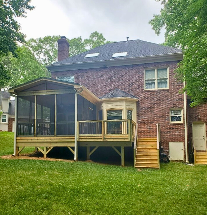 Screened porch and pressure-treated deck in Huntersville NC.