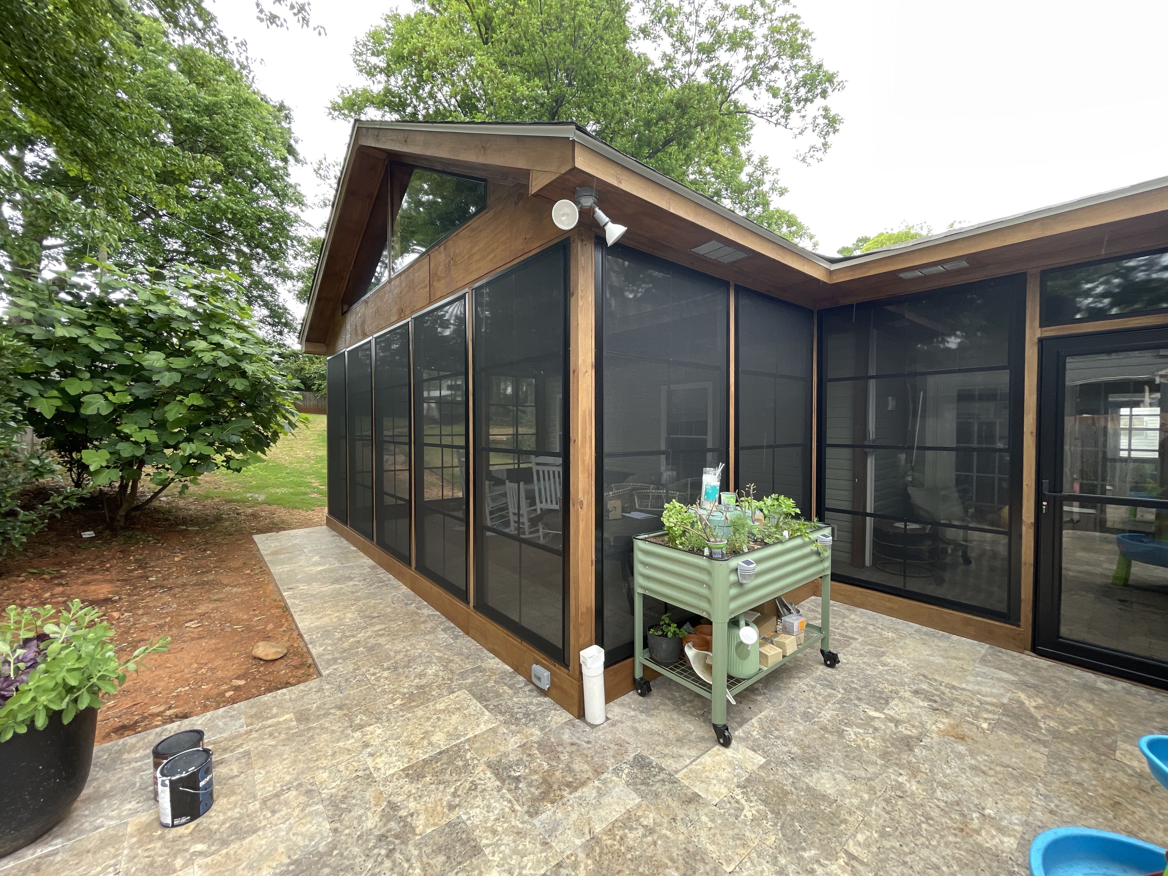Patio enclosure in Plainfield, IL featuring a gorgeous paver patio and screened porch with Eze-breeze windows.