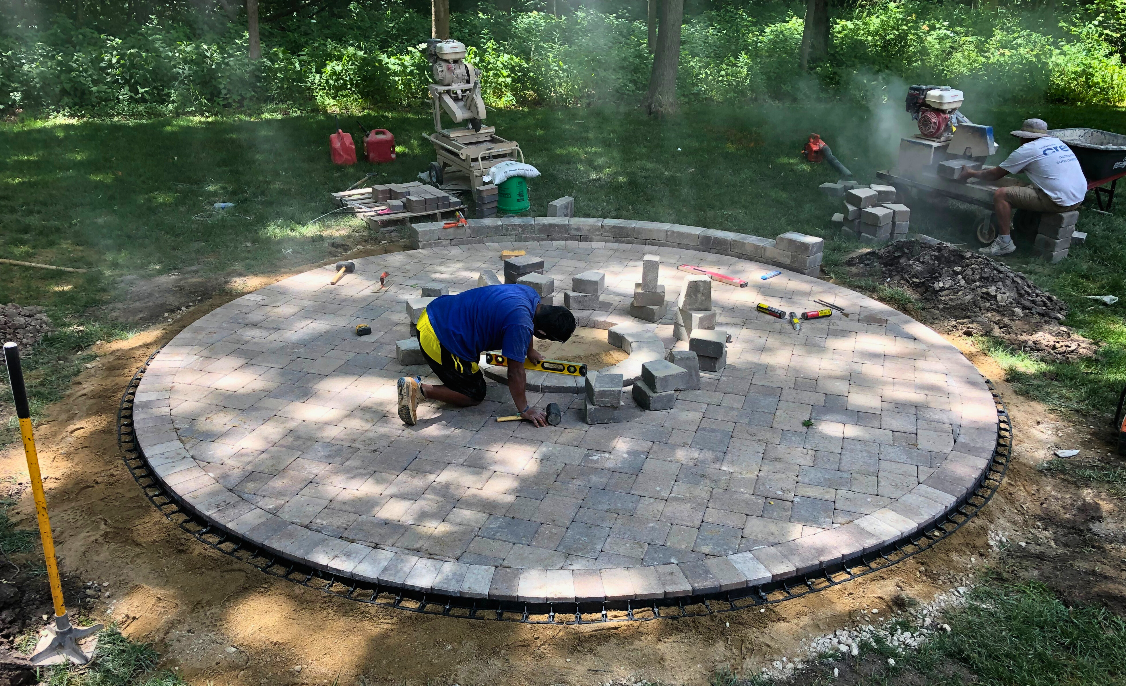Patio installers, Archadeck of Chicagoland installing a fire pit in Hoffman Estates, IL.