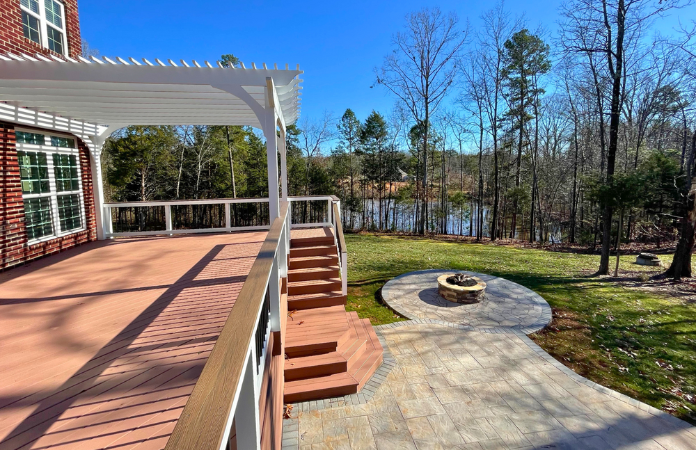 Wood deck, paver patio, firepit, and pergola design.