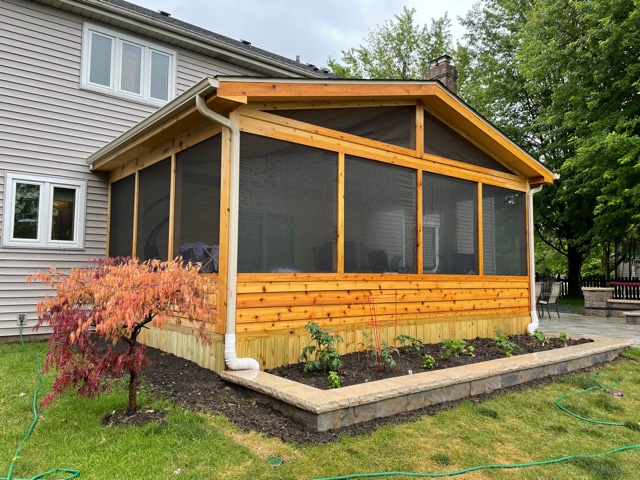 Outside of a stained screened porch in arlington heights built by local porch contractor, Archadeck..