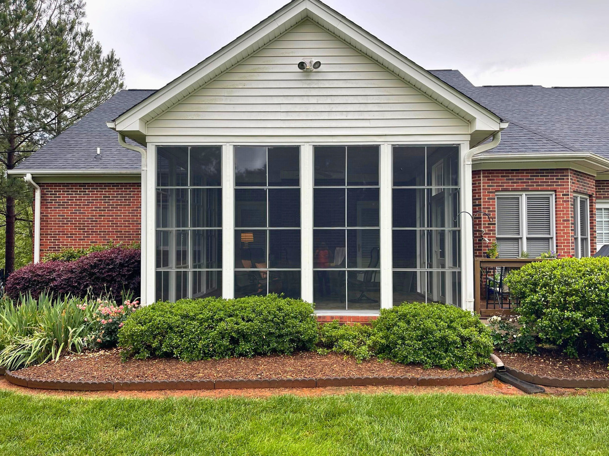 eze breeze porch with stone fireplace