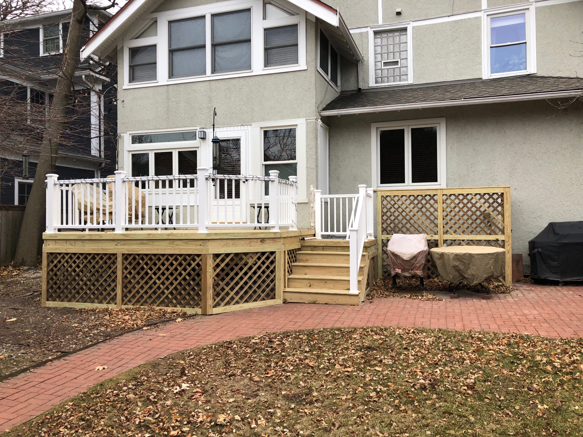 Wood Deck with white rails and lattice skirting in Evanston, IL