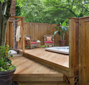 private deck with hot tub and outdoor shower