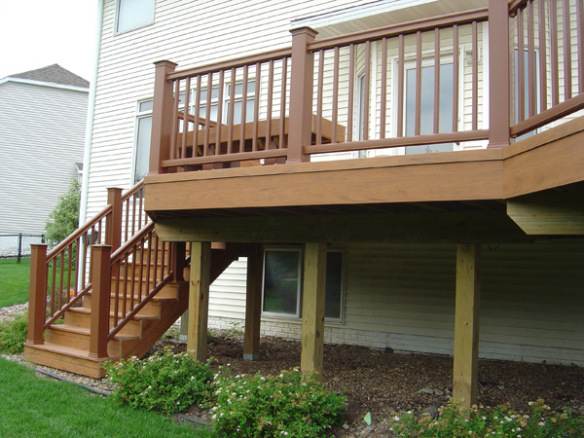 multi level deck with wood railing and stairs