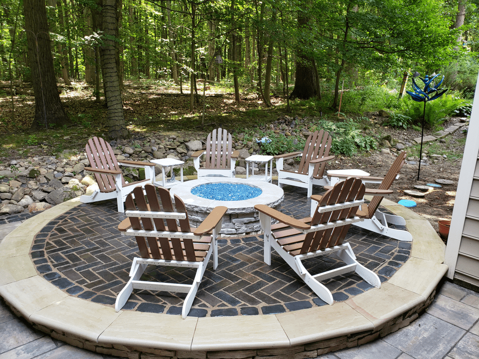 chairs around a firepit outside
