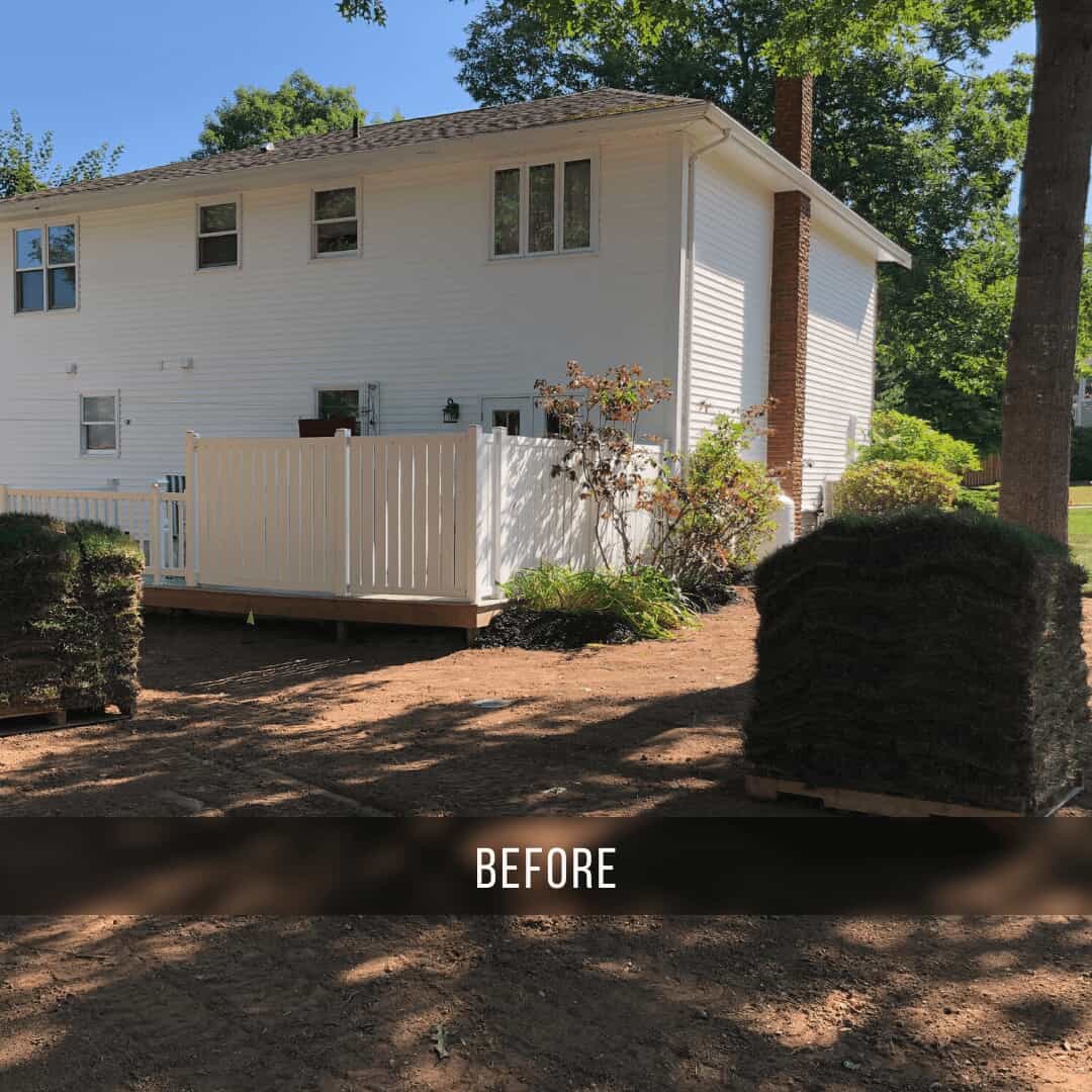 Before photo of the backyard with existing ground level deck