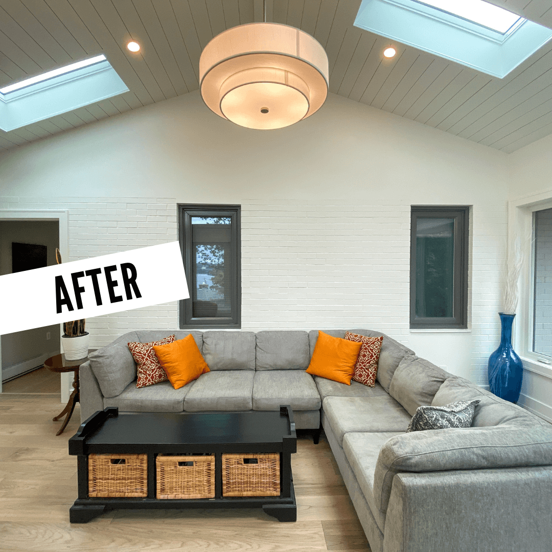 After photo of the sunroom, skylights, couch, and center table, from inside