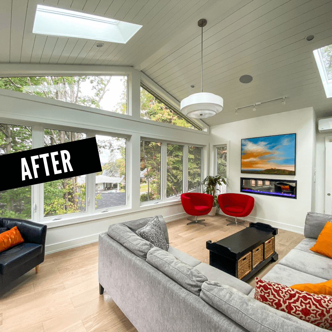 After photo of the sunroom, looking outside, with fireplace, skylights, and glass panels