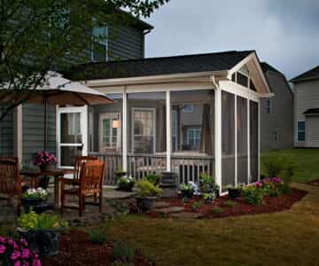 Screened porch and patio outdoor living combination space.