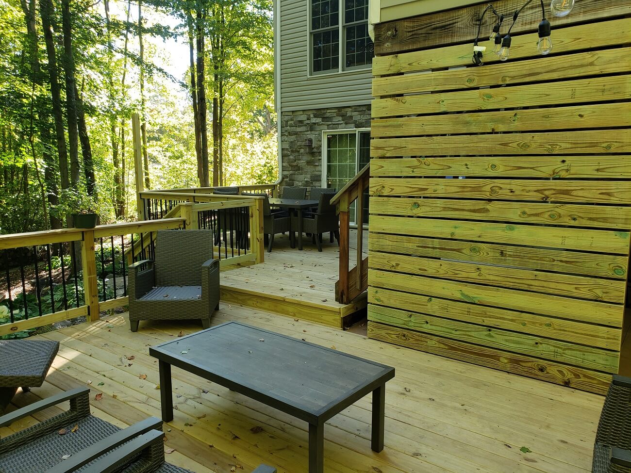 Wooden Deck with Stamped Concrete Patio