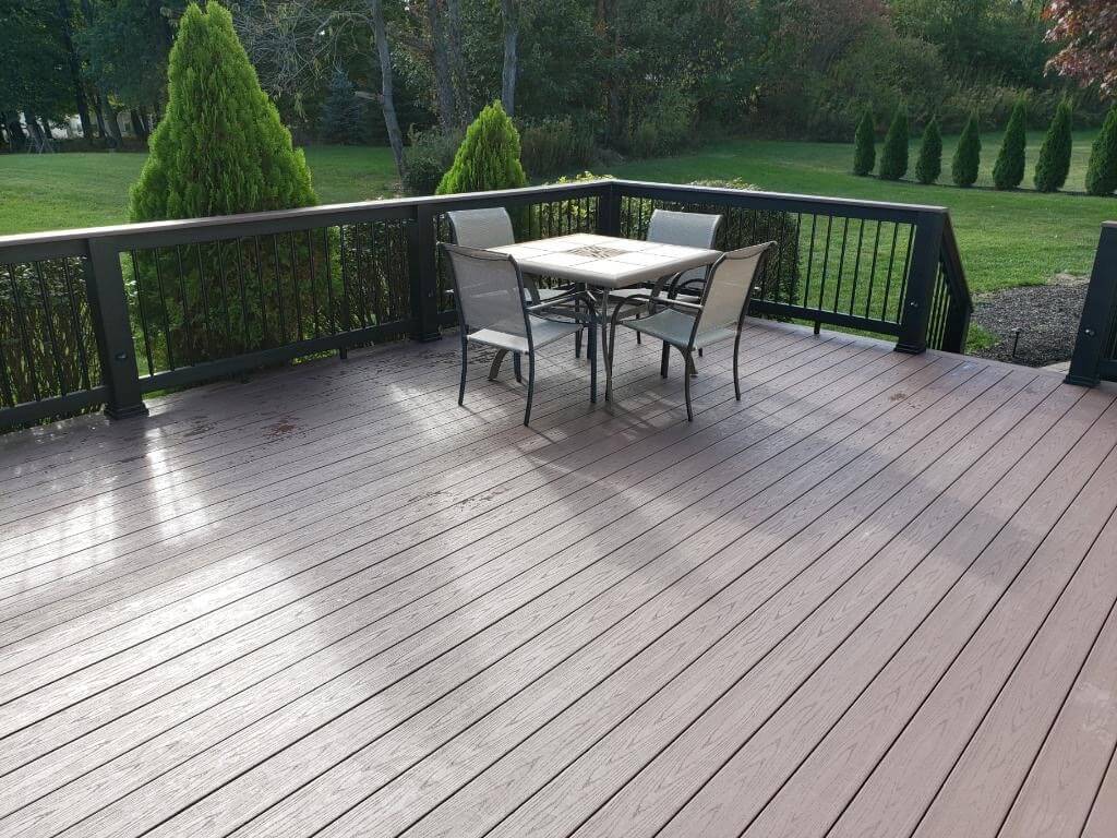 Backyard deck with railing and seating area
