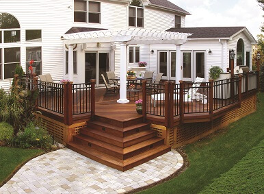 Wood deck with white pergola and railing