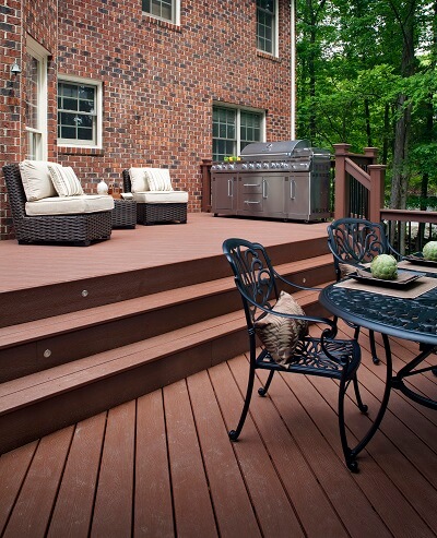 Multi-level deck with outdoor kitchen and seating area