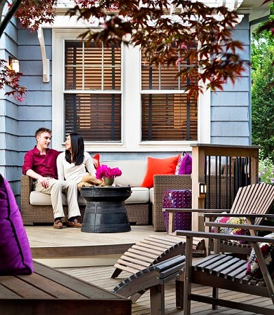 Couple hanging out on cozy deck