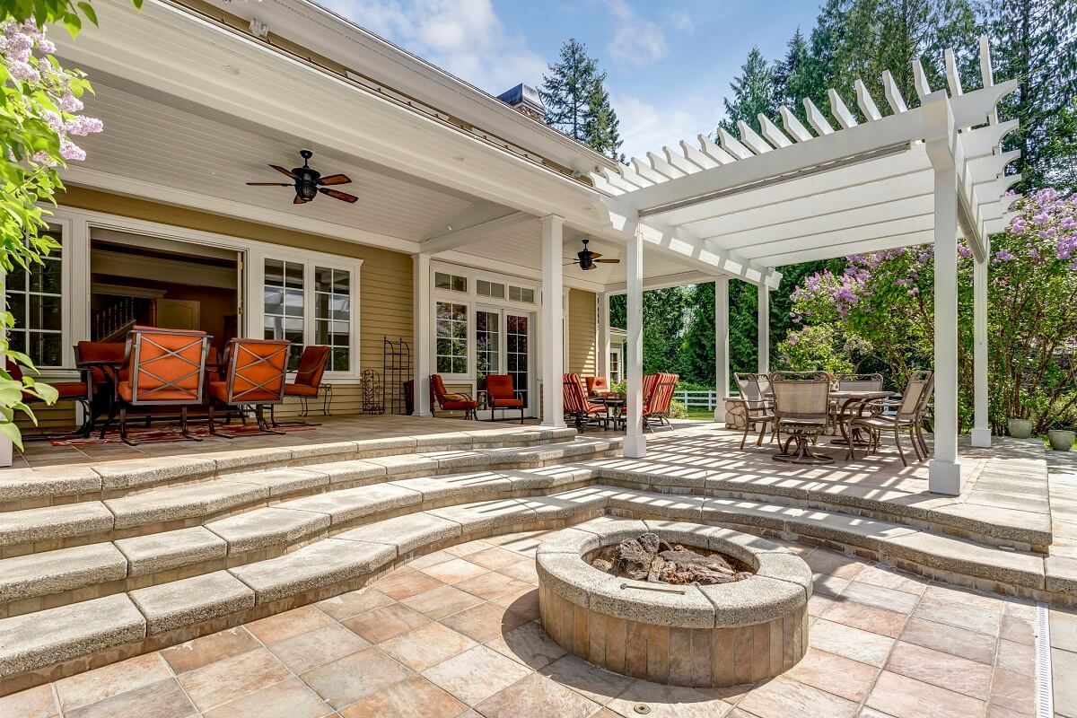 Deck and patio with seating area and fire pit