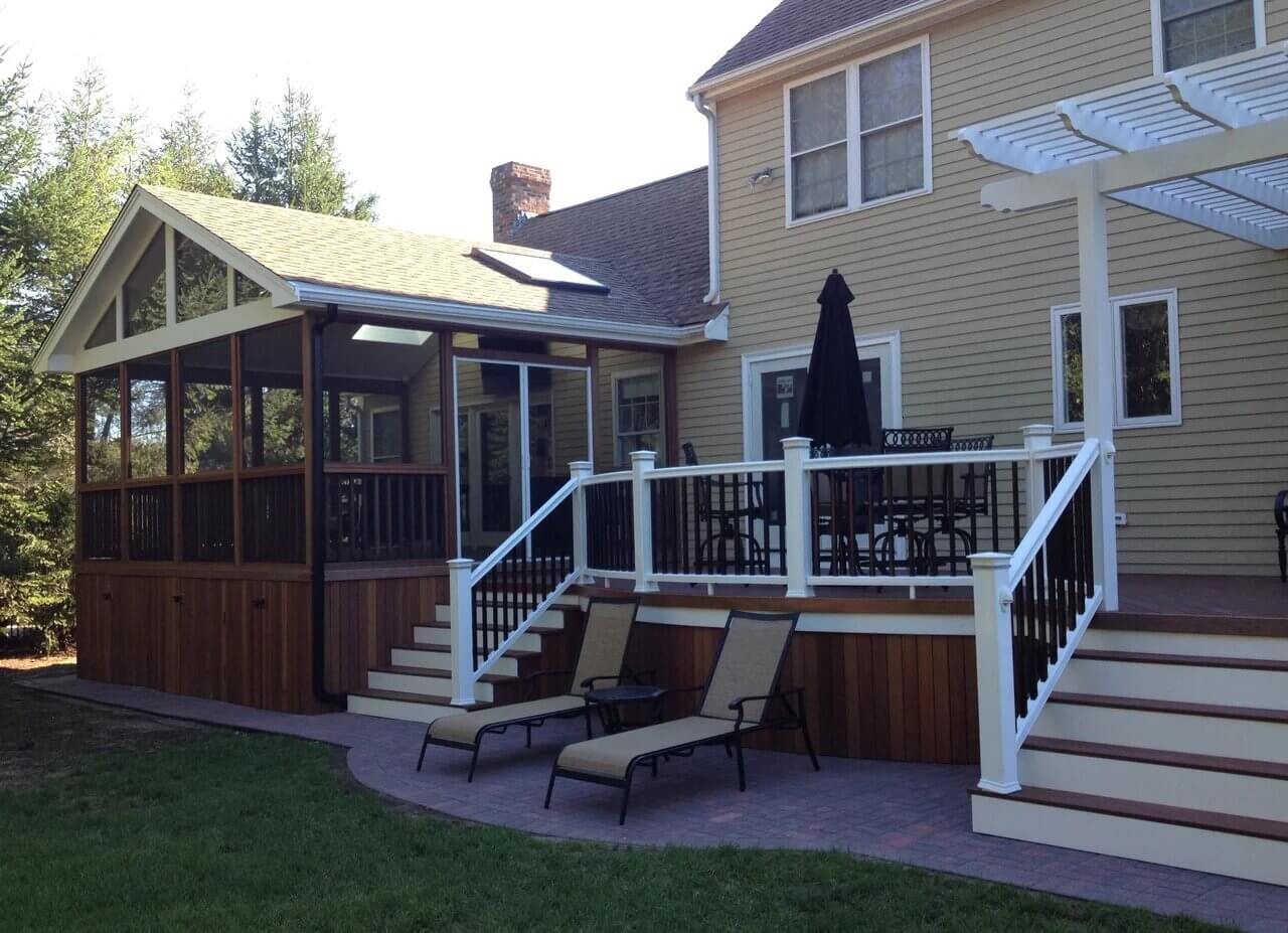 Screened porch and wood deck with railing