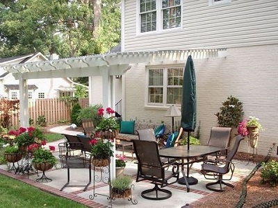 Patio with pergola over seating area