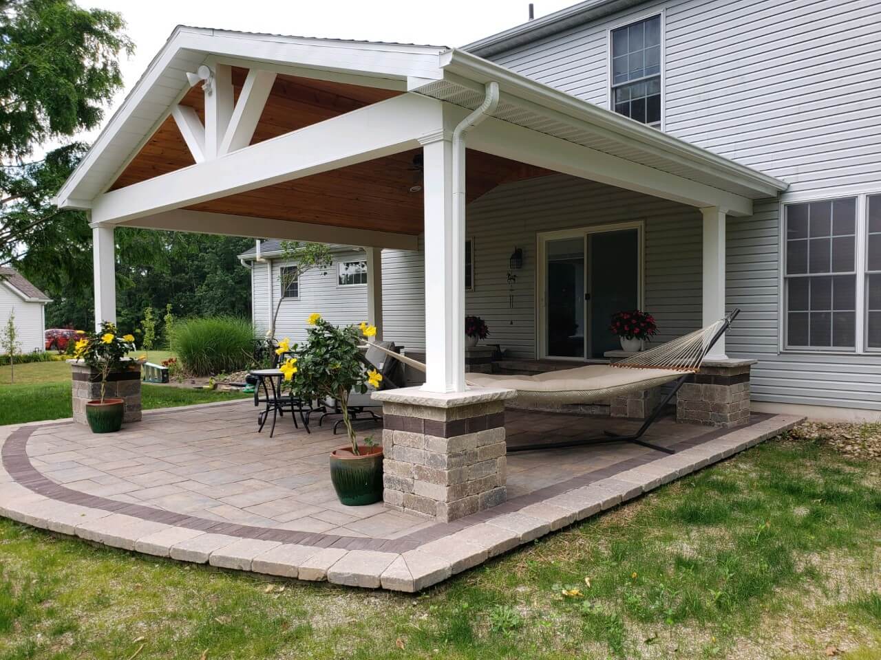 Covered porch with stone columns