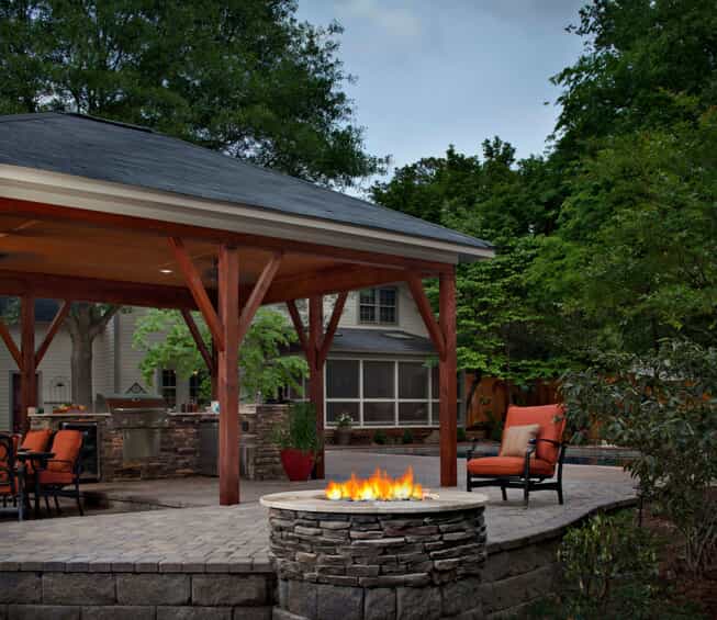 Should I Install an Outdoor Fireplace or Firepit - JT Landscaping