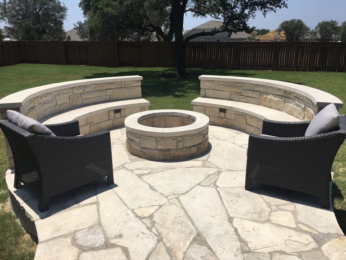 Custom patio with fire pit and seat wall