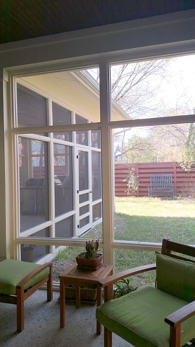 Screened porch with seating area