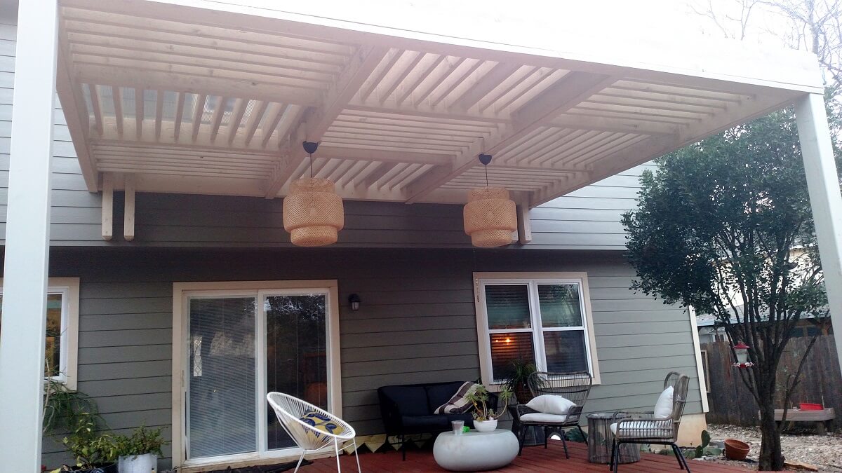Backyard deck with pergola and light fixtures