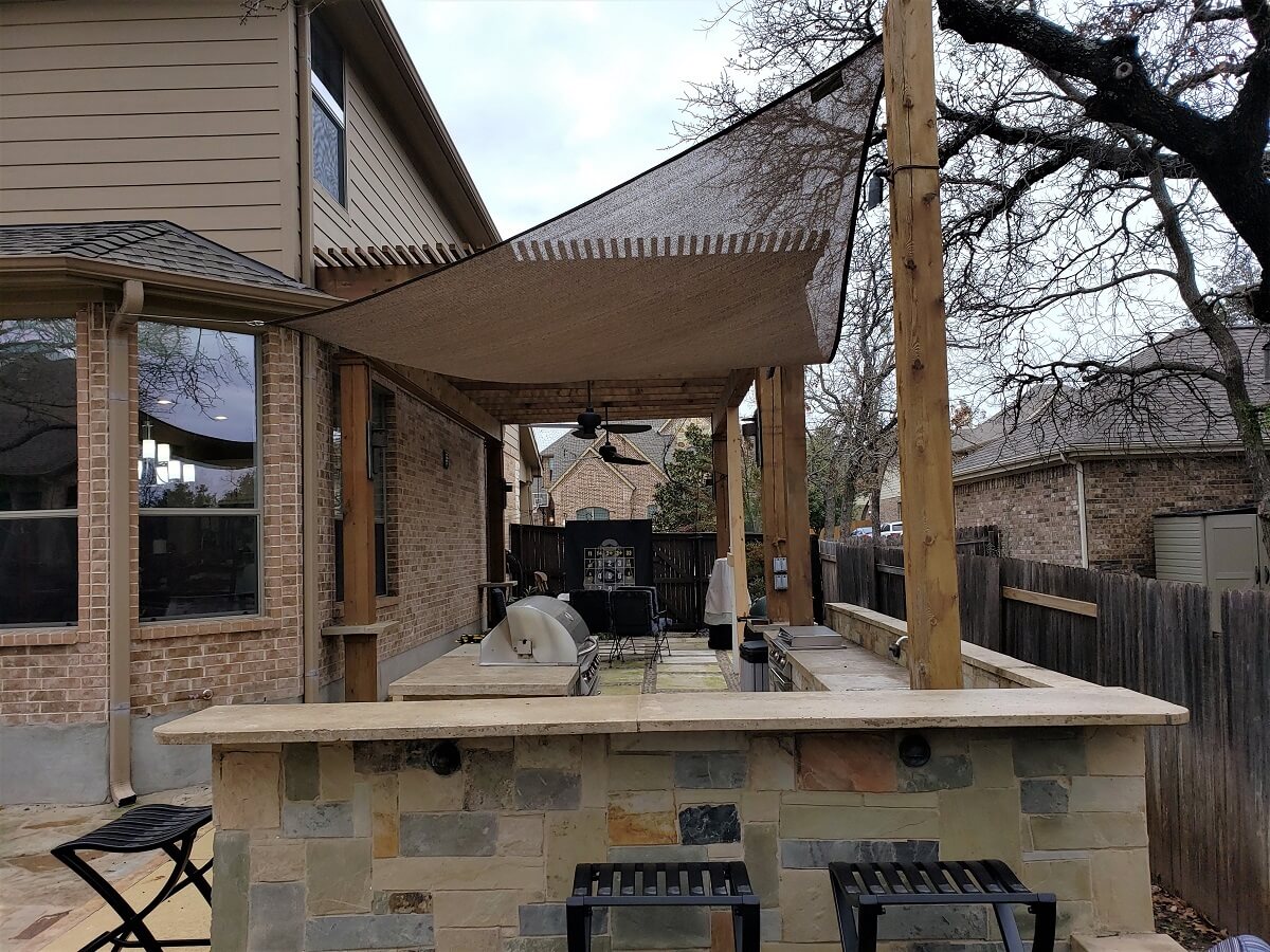 Pergola covered patio with outdoor kitchen