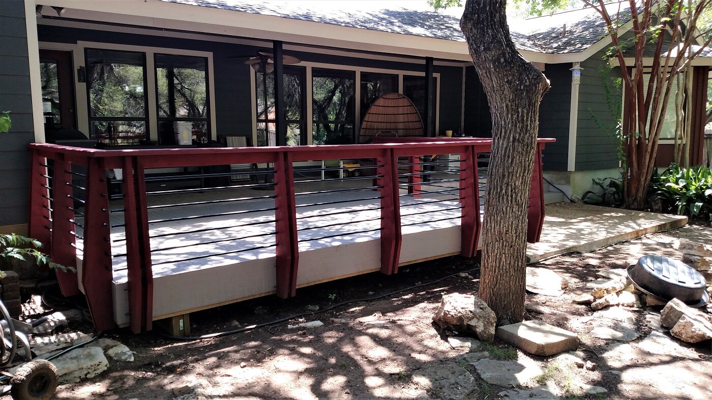 Backyard wood deck with railing